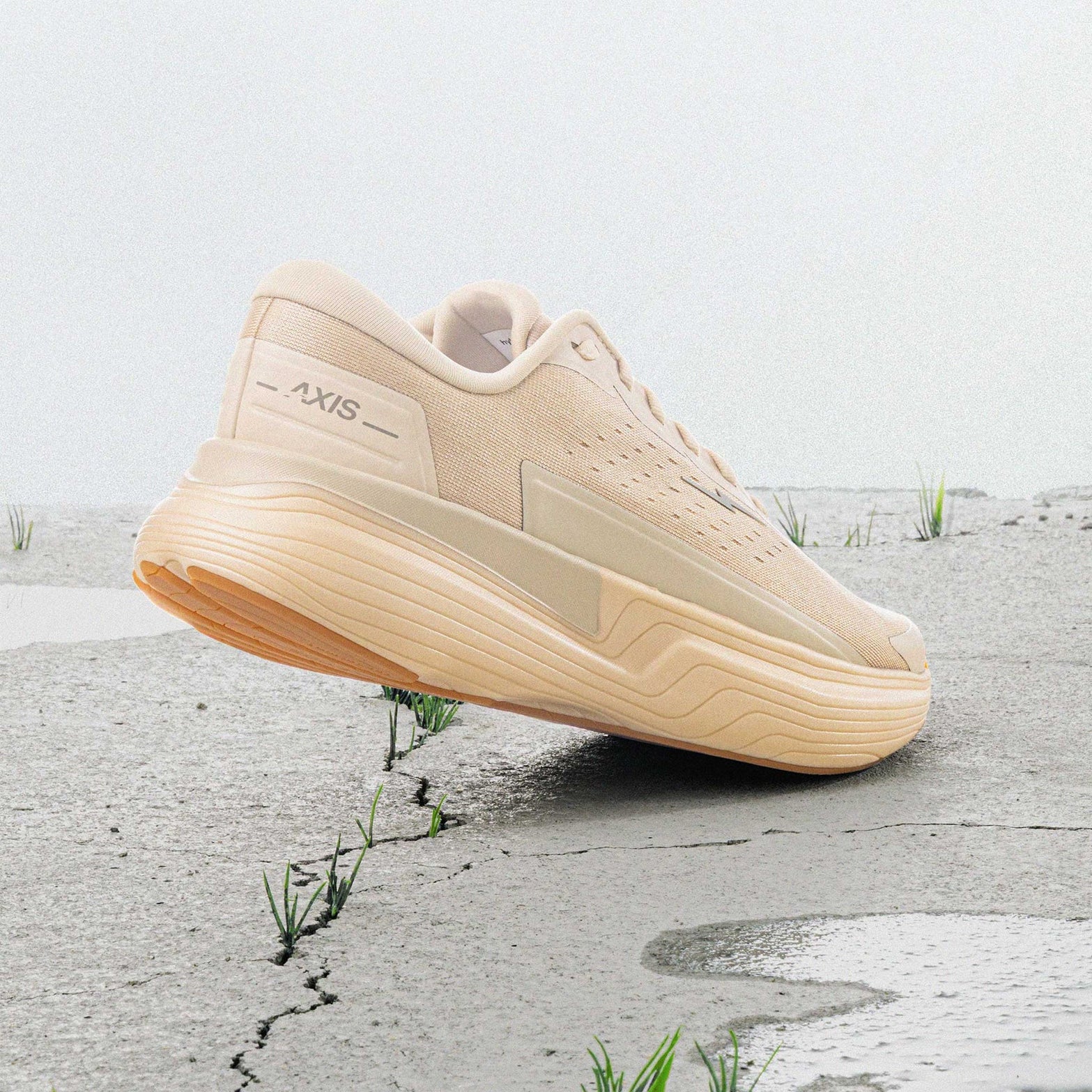Hylo AXIS Running Shoes Beige heel view showing PureGlide SP sculpted midsole geometry with corn-derived collar and maximum cushioning construction